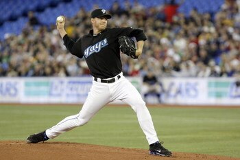 TORONTO - APRIL 6: Roy Halladay #32 of the Toronto Blue Jays delivers a pitch against the Boston Red Sox during their MLB game at the Rogers Centre April 6, 2008 in Toronto, Ontario. (Photo By Dave Sandford/Getty Images)