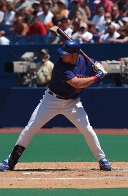 TORONTO - JULY 14 :  Third Baseman Eric Hinske #11 of the Toronto Blue Jays readies at the plate against the Boston Red Sox during the game on July 14, 2002 at the Skydome in Toronto, Canada.  The Blue Jays edged the Red Sox 6-5.  (Photo by Dave Sandford/