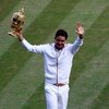 WIMBLEDON, ENGLAND - JULY 05:  Roger Federer of Switzerland celebrates victory with the trophy after the men's singles final match against Andy Roddick of USA on Day Thirteen of the Wimbledon Lawn Tennis Championships at the All England Lawn Tennis and Cr