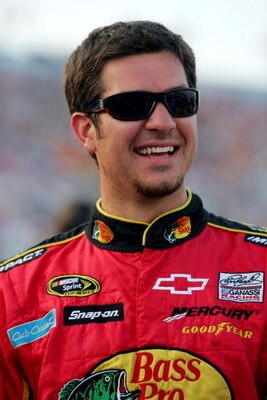 DAYTONA BEACH, FL - JULY 04: Martin Truex Jr, driver of the #1 Bass Pro Shops/Tracker Boats Chevrolet, stands on the grid prior to the NASCAR Sprint Cup Series 51st Annual Coke Zero 400 at Daytona International Speedway on July 4, 2009 in Daytona Beach, F