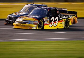 CONCORD, NC - MAY 15:  Ron Hornaday, Jr., driver of the #33 Longhorn Chevrolet, races Kyle Busch, driver of the #51 Miccosukee Resort Toyota during the NASCAR Camping World Series North Carolina Education Lottery 200 on May 15, 2009 at Lowe's Motor Speedw
