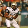 MIAMI - AUGUST 28:  Running back Sam Baptiste #33 of the Charleston Southern Buccaneers looks for room to run while taking on the Miami Hurricanes at Dolphin Stadium on August 28, 2008 in Miami, Florida. Miami defeated Charleston Southern 52-7.  (Photo by