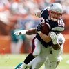 MIAMI - NOVEMBER 23:  Wide receiver Wes Welker #83 of the New England Patriots breaks free from a tackle attempt by linebacker Akin Ayodele #51 of the Miami Dolphins at Dolphin Stadium on November 23, 2008 in Miami, Florida.  (Photo by Doug Benc/Getty Ima