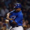 CHICAGO - OCTOBER 7:  First baseman Randall Simon #35 of the Chicago Cubs swings during game one of the National League Championship Series against the Florida Marlins on October 7, 2003 at Wrigley Field in Chicago, Illinois. The Marlins won 9-8. (Photo b