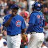 CHICAGO - APRIL 15: Relief pitcher LaTroy Hawkins #32 of the Chicago Cubs is congratulated by catcher Michael Barrett #5 after finishing the game against the Pittsburgh Pirates on April 15, 2004 at Wrigley Field in Chicago, Illinois. The Cubs defeated the