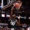 1990:  Center Robert Parish #00 of the Boston Celtics focuses on the rim as he leaps for a slam dunk during a Celtics game against the Philadelphia 76ers at the Spectrum in Philadelphia, Pennsylvania.   Mandatory Credit: Allsport USA/ALLSPORT