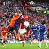 LONDON - APRIL 18:  Petr Cech of Chelsea punches clear from Kolo Toure of Arsenal during the FA Cup sponsored by E.ON Semi Final match between Arsenal and Chelsea at Wembley Stadium on April 18, 2009 in London, England.  (Photo by Phil Cole/Getty Images)