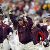 PHILADELPHIA - NOVEMBER 15:  Offensive coordinater Bryan Stinespring of the Virginia Tech Hokies celebrates during the game against the Temple Owls on November 15, 2003 at Lincoln Financial Field in Philadelphia, Pennsylvania. Virginia Tech defeated Templ