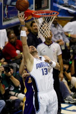 ORLANDO, FL - JUNE 14:  Marcin Gortat #13 of the Orlando Magic puts a shot up in Game Five of the 2009 NBA Finals against the Los Angeles Lakers on June 14, 2009 at Amway Arena in Orlando, Florida.  The Lakers won 99-86.  NOTE TO USER:  User expressly ack