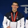 BEIJING - AUGUST 17:  Michael Phelps of the United States hold his award from FINA after receiving his gold medal at the medal ceremony for the Men's 4x100 Medley Relay at the National Aquatics Centre during Day 9 of the Beijing 2008 Olympic Games on Augu