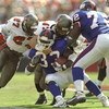 4 Oct 1998:  Runningback Gary Brown #33 of the New York Giants is tackled by Anthony Parker #27 of the Tampa Bay Buccaneers during a game at the Raymond James Stadium in Tampa, Florida. The Buccaneers defeated the Giants 20-3.
