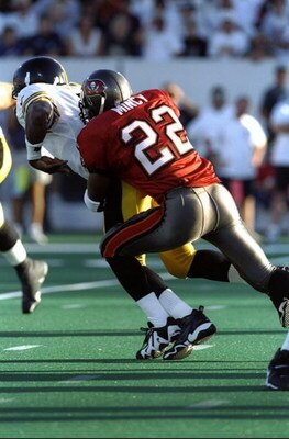 1 Aug 1998:  Quarterback Kordell Stewart #10 of the Pittsburgh Steelers being tackled by Charles Mincy #22 during the Pro Football Hall of Fame Game against the Tampa Bay Buccaneers at the Fawcett Stadium in Canton, Ohio. The Buccaneers defeated the Steel