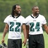 PHILADELPHIA - MAY 1: Defensive backs Asante Samuel #22 and Sheldon Brown #24 of the Philadelphia Eagles smile as they look on during minicamp at the NovaCare Complex on May 1, 2009 in Philadelphia, Pennsylvania. (Photo by Hunter Martin/Getty Images)