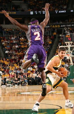 SEATTLE - NOVEMBER 01:  Wally Szczerbiak #3 of the Seattle SuperSonics drives against Marcus Banks #2 of the Phoenix Suns on November 1, 2007 at Key Arena in Seattle, Washington. The Suns defeated the Sonics 106-99. NOTE TO USER: User expressly acknowledg