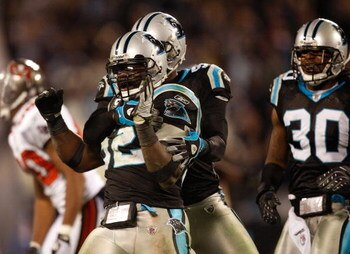 CHARLOTTE, NC - DECEMBER 08:  Jon Beason #52 of the Carolina Panthers reacts to making a stop on defense against the Tampa Bay Buccaneers at Bank of America Stadium on December 8, 2008 in Charlotte, North Carolina  (Photo by Streeter Lecka/Getty Images)