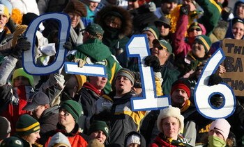 GREEN BAY, WI - DECEMBER 28: Fans hold signs indicating the impending record of the Detroit Lions during a game between the Lions and the Green Bay Packers on December 28, 2008 at Lambeau Field in Green Bay, Wisconsin. The Packers defeated the Lions 31-21