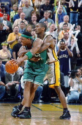 INDIANAPOLIS - APRIL 29:  Ron Artest #23 of the Indiana Pacers fouls Paul Pierce #34 of the Boston Celtics in Game five of the Eastern Conference Quarterfinals during the 2003 NBA Playoffs at Conseco Fieldhouse on April 29, 2003 in Indianapolis, Indiana. 