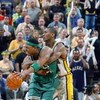 INDIANAPOLIS - APRIL 29:  Ron Artest #23 of the Indiana Pacers fouls Paul Pierce #34 of the Boston Celtics in Game five of the Eastern Conference Quarterfinals during the 2003 NBA Playoffs at Conseco Fieldhouse on April 29, 2003 in Indianapolis, Indiana. 