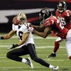 ATLANTA - NOVEMBER 9: Wide receiver Lance Moore #16 of the New Orleans Saints reaches for a pass against the Atlanta Falcons at the Georgia Dome on November 9, 2008 in Atlanta, Georgia.  (Photo by Al Messerschmidt/Getty Images)