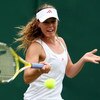 WIMBLEDON, ENGLAND - JUNE 22:  Michelle Larcher de Brito of Portugal plays a forehand during the women's singles final match against Klara Zakopalova of Czech Republic on Day One of the Wimbledon Lawn Tennis Championships at the All England Lawn Tennis an