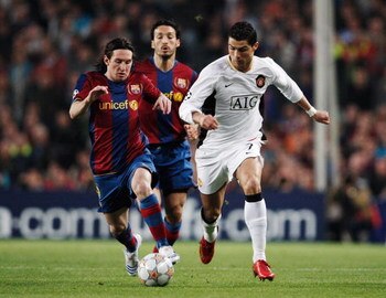 BARCELONA, SPAIN - APRIL 23:  Cristiano Ronaldo (R) of Manchester United holds off the challenge of Lionel Messi (L) of Barcelona during the UEFA Champions League Semi-Final, first leg match between Barcelona and Manchester United at the Camp Nou stadium 