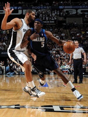 SAN ANTONIO - APRIL 28:  Forward Josh Howard #5 of the Dallas Mavericks dribbles the ball past Tim Duncan #21 of the San Antonio Spurs in Game Five of the Western Conference Quarterfinals during the 2009 NBA Playoffs at AT&T Center on April 28, 2009 in Sa