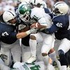 STATE COLLEGE, PA - NOVEMBER 22:  Glenn Winston #41 of the Michigan State Spartans is stopped for a loss by Josh Hull #43 and Tyrell Sales #46 of the Penn State Nittany Lions on November 22, 2008 at Beaver Stadium in State College, Pennsylvania.  (Photo b