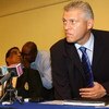 KINGSTON, JAMAICA - MARCH 22:  Deputy Chief of Police for Jamaica Mark Shields (R) sits down alongside ICC Police Director of Communications Carl Angell to talk to the media during a press conference to confirm that a murder investigation is now under way