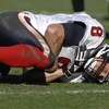 Houston Texans quarterback David Carr falls to the turf with an injured shoulder against the Jacksonville Jaguars  Nov. 12, 2006 in Jacksonville.  The Texans won 13 - 10.  (Photo by Al Messerschmidt/Getty Images)