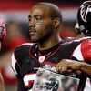 ATLANTA - DECEMBER 10:  DeAngelo Hall #21 of the Atlanta Falcons holds up a poster of Michael Vick during player introductions against the New Orleans Saints on December 10, 2007 at the Georgia Dome in Atlanta, Georgia.  (Photo by Chris Graythen/Getty Ima
