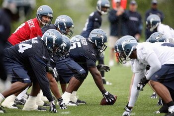 RENTON, WA - MAY 2:  Center Chris Spencer #65 prepares to snap the ball to Matt Hasselbeck #8 of the Seattle Seahawks during minicamp at the Seahawks training facility on May 2, 2009 in Renton, Washington. (Photo by Otto Greule Jr/Getty Images) 