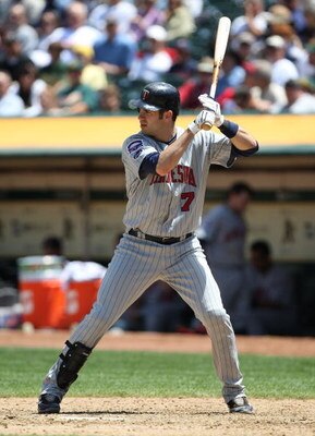 OAKLAND, CA - JUNE 11:  Joe Mauer #7 of the Minnesota Twins bats against the Oakland Athletics during a Major League Baseball game on June 11, 2009 at the Oakland Coliseum in Oakland, California.  (Photo by Jed Jacobsohn/Getty Images)