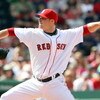 BOSTON - JULY 05:  Jon Lester #31 of the Boston Red Sox delivers a pitch against the Seattle Mariners on July 5, 2009 at Fenway Park in Boston, Massachusetts.  (Photo by Elsa/Getty Images)