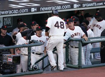 SAN FRANCISCO - MAY 17:  Pablo Sandoval #48 of the San Francisco Giants is congratulated by teammates after he scored on a hit by Bengie Molina in the first inning of their game against the New York Mets at AT&T Park on May 17, 2009 in San Francisco, Cali