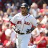BOSTON - JULY 05:  Dustin Pedroia #15 of the Boston Red Sox celebrates his solo home run in the first inning against the Seattle Mariners on July 5, 2009 at Fenway Park in Boston, Massachusetts.  (Photo by Elsa/Getty Images)