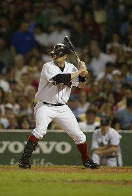 BOSTON, MA - SEPTEMBER 3:  Doug Mientkiewicz #13 of Boston Red Sox bats against the Texas Rangers on September 3, 2004 at Fenway Park in Boston, Massachusetts.(Photo by Rick Stewart/Getty Images)