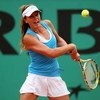 PARIS - MAY 29:  Michelle Larcher De Brito of Portugal  hits a backhand during the Women's Singles Third Round match against Aravane Rezai of France on day six of the French Open at Roland Garros on May 29, 2009 in Paris, France.  (Photo by Ryan Pierse/Ge