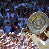 WIMBLEDON, ENGLAND - JULY 04:  Serena Williams of USA celebrates with the Championship trophy after the women's singles final match against Venus Williams of USA on Day Twelve of the Wimbledon Lawn Tennis Championships at the All England Lawn Tennis and C