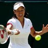 WIMBLEDON, ENGLAND - JUNE 23:  Kimiko Date Krumm of Japan plays a forehand during the women's singles first round match against Caroline Wozniacki of Denmark on Day Two of the Wimbledon Lawn Tennis Championships at the All England Lawn Tennis and Croquet 