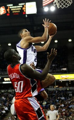 SACRAMENTO, CA - JANUARY 30:  Kevin Martin #23 of the Sacramento Kings shoots over Emeka Okafor #50 of the Charlotte Bobcats during an NBA game on January 30, 2008 at ARCO Arena in Sacramento, California. NOTE TO USER: User expressly acknowledges and agre