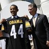 WASHINGTON  - MAY 21:  U.S. President Barack Obama (L) holds up a jersey as Pittsburgh Steelers as President Art Rooney II (3rd R), looks on at the South Portico of White House May 21, 2009 in Washington, DC. The Steelers deafeated the Arizona Cardinals i