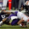 ATLANTA - DECEMBER 31:  Antonio Coleman #52 and Chris Evans #59 of the Auburn University Tigers tackle Cullen Harper #10 of the Clemson University Tigers during the Chick-Fil-A Bowl on December 31, 2007 at the Georgia Dome in Atlanta, Georgia.  (Photo by 