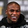 LAS VEGAS - DECEMBER 08:  Floyd Mayweather Jr. speaks during his post fight news conference after knocking out Ricky Hatton of England in the 10th round after their WBC world welterweight championship fight at the MGM Grand Garden Arena on December 8, 200