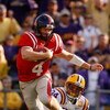 BATON ROUGE, LA - NOVEMBER 22:  Quarterback Jevan Snead #4 of the Ole Miss Rebels scrambles after a missed tackle by Rahim Alem #84 of the Louisiana State University Tigers  on November 22, 2008 at Tiger Stadium in Baton Rouge, Louisiana.  (Photo by Chris