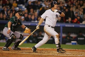 NEW YORK - APRIL 18:  Tino Martinez #24 of the New York Yankees hits a grand slam against the Tampa Bay Devil Rays during a thirteen run second inning of their game April 18, 2005 at Yankee Stadium in the Bronx Borough of New York City.  (Photo by Al Bell