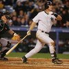 NEW YORK - APRIL 18:  Tino Martinez #24 of the New York Yankees hits a grand slam against the Tampa Bay Devil Rays during a thirteen run second inning of their game April 18, 2005 at Yankee Stadium in the Bronx Borough of New York City.  (Photo by Al Bell