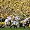ANN ARBOR, MI - SEPTEMBER 23:  John Stocco #7 of the Wisconsin Badgers hands off to Dywon Rowan #21 against the Michigan Wolverines on September 23, 2006 at Michigan Stadium in Ann Arbor, Michigan. Michigan defeated Wisconsin 27-13.  (Photo by Jonathan Da