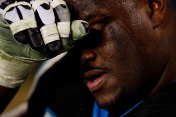 CHARLOTTE, NC - JANUARY 10:  Travelle Wharton #70 of the Carolina Panthers reacts while on the bench at the end of the fourth quarter of the game against the Arizona Cardinals during the NFC Divisional Playoff Game on January 10, 2009 at Bank of America S