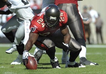 TAMPA, FL - DECEMBER 28: Running back Carnell Williams #24 of the Tampa Bay Buccaneers fumbles a handoff against the Oakland Raiders at Raymond James Stadium on December 28, 2008 in Tampa, Florida.  (Photo by Al Messerschmidt/Getty Images)