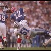 31 Jan 1993: Linebacker Ken Norton #51 of the Dallas Cowboys tackles Buffalo Bills quarterback Jim Kelly #12 during Super Bowl XXVII at the Rose Bowl in Pasadena, California. The Cowboys won the game, 52-17.